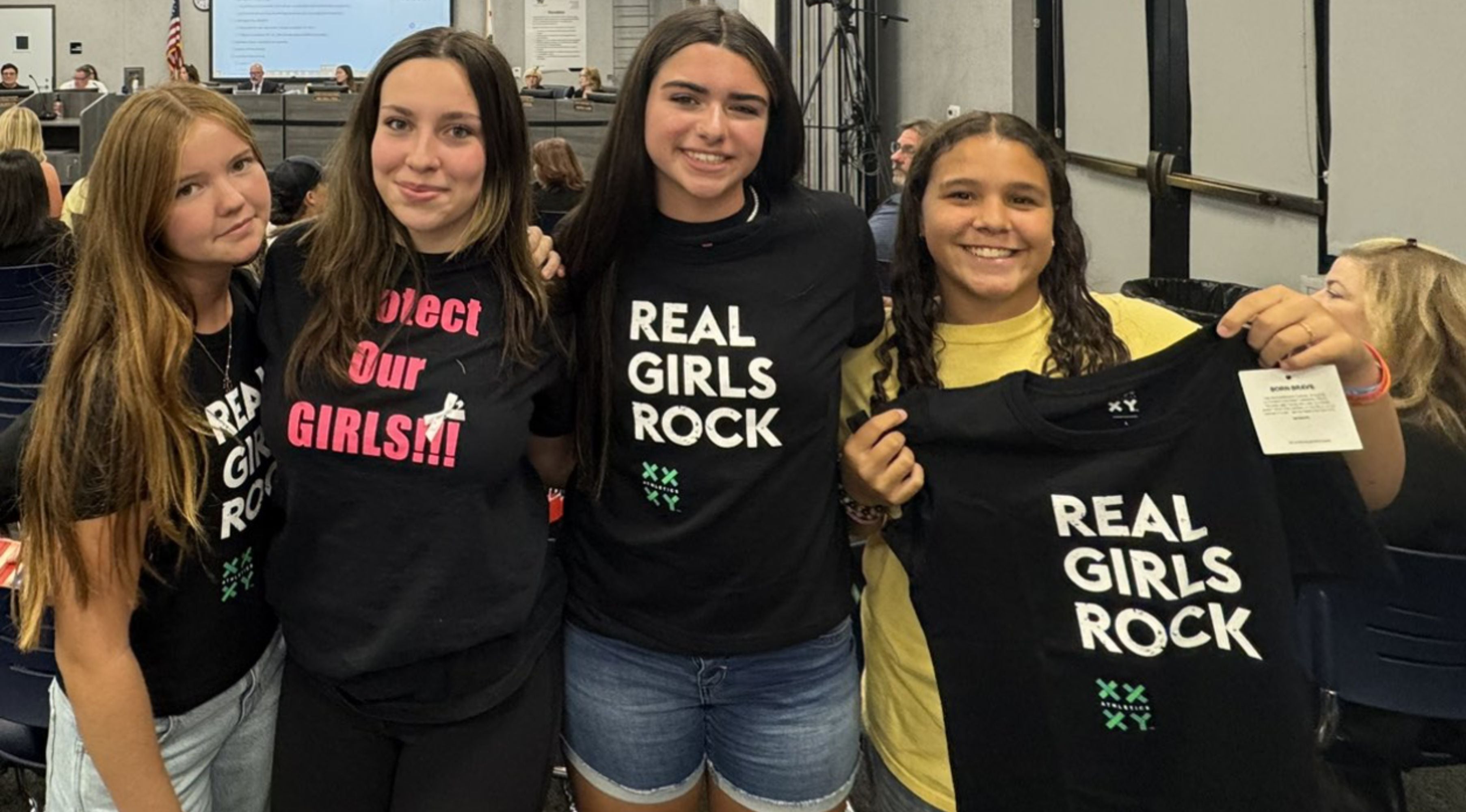 Image of 4 girls holding up XX-XY Real Girls Rock T-Shirts