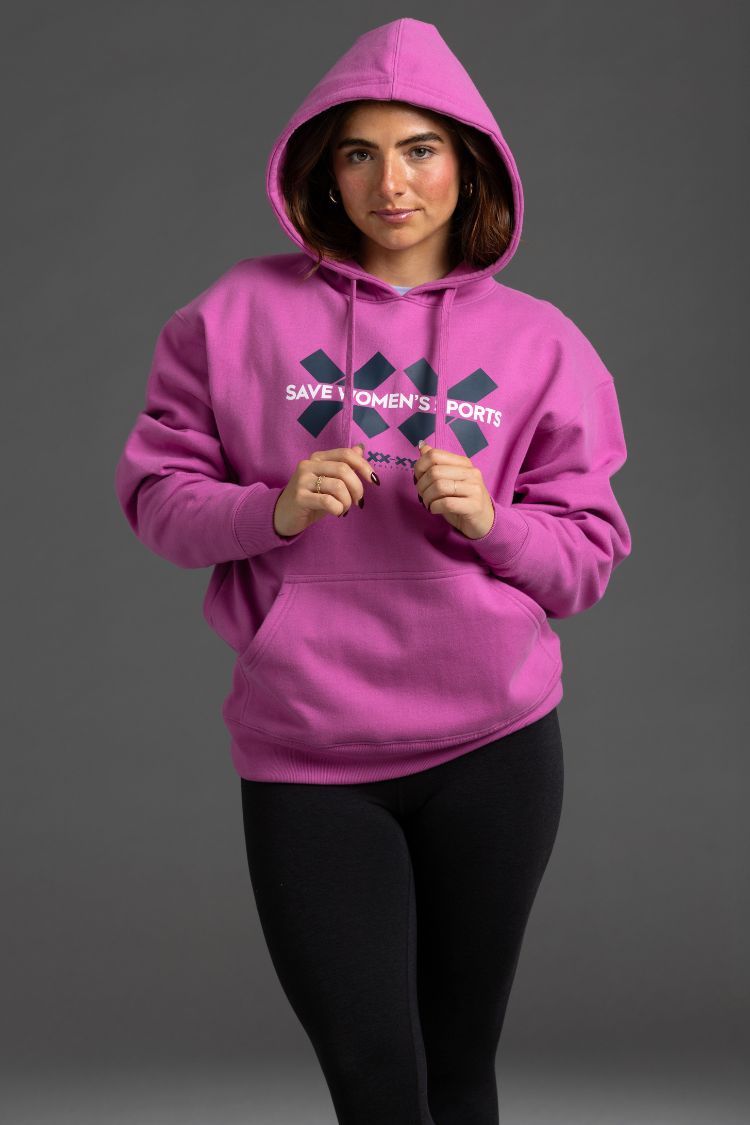 Person wearing a pink hoodie with text on a gray background