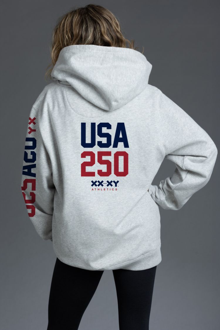 Person wearing a gray hoodie with 'USA 250' text on the back against a gray background