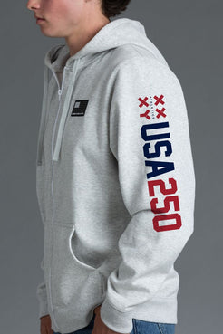 Gray hoodie with 'USA 250' text on sleeve against a gray background || Light Heather Gray