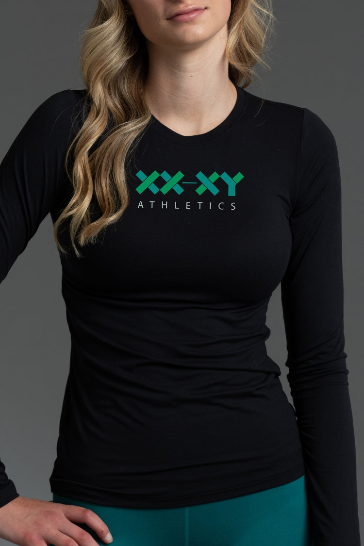 Person wearing a black long-sleeve shirt with 'XX-XY Athletics' logo on a gray background || Black