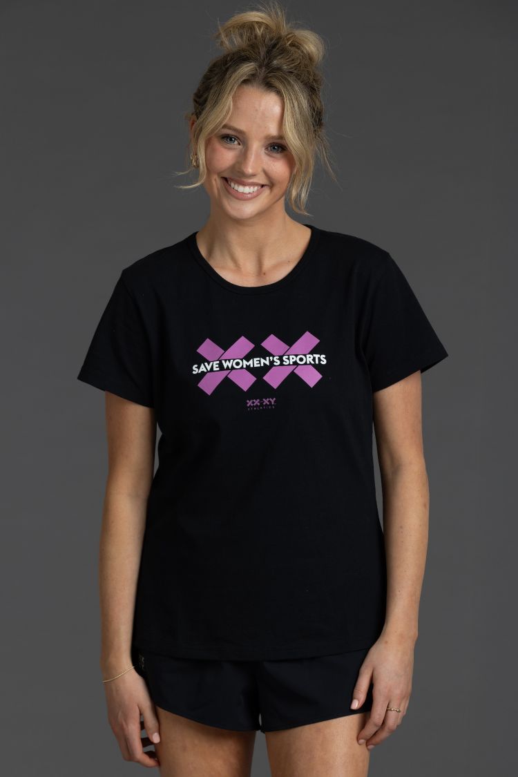 Woman wearing a black t-shirt with pink graphics and text on a gray background || Bright Fuchsia