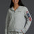 Woman wearing a gray hoodie with 'USA 250' text on a dark background || Light Heather Gray