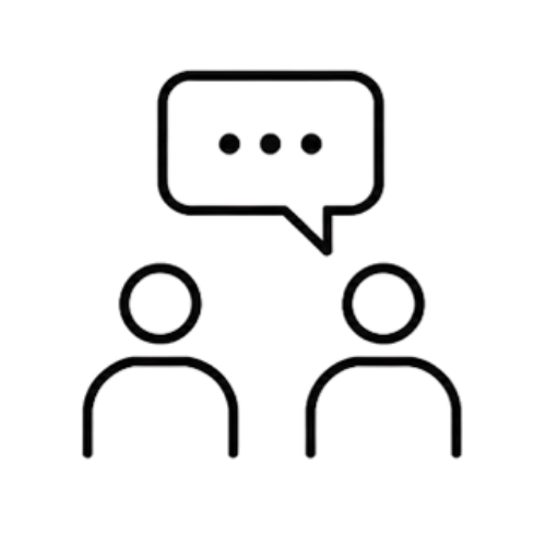 A minimalist black line icon depicting two human figures with a speech bubble containing ellipses, set against a solid white background.