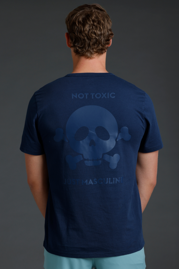 Person wearing a navy blue t-shirt with a skull design and text || Navy