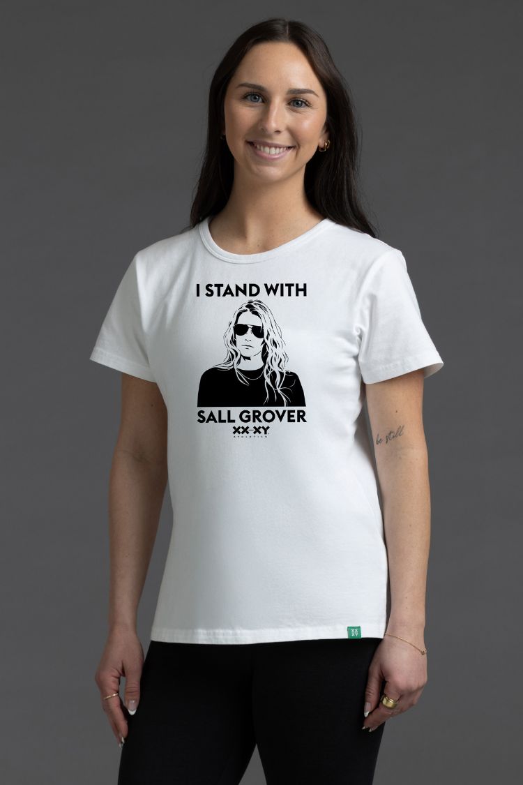 Woman wearing a white t-shirt with a graphic and text on a gray background || White
