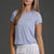 Woman wearing Lavender t-shirt and white shorts || Lavender Gray