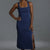 Woman wearing a blue dress with a gray background || Navy