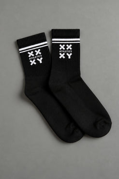 Black socks with white logo on a gray background || black