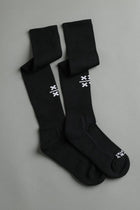 Black socks with white logo on a gray background || Black