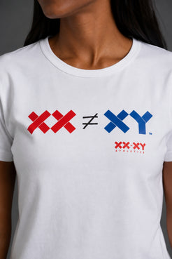A close-up of a white crewneck t-shirt worn by a model. The shirt features a graphic print on the chest reading 'XX ≠ XY' in red and blue, with 'XX-XY Athletics' printed below in red. || White