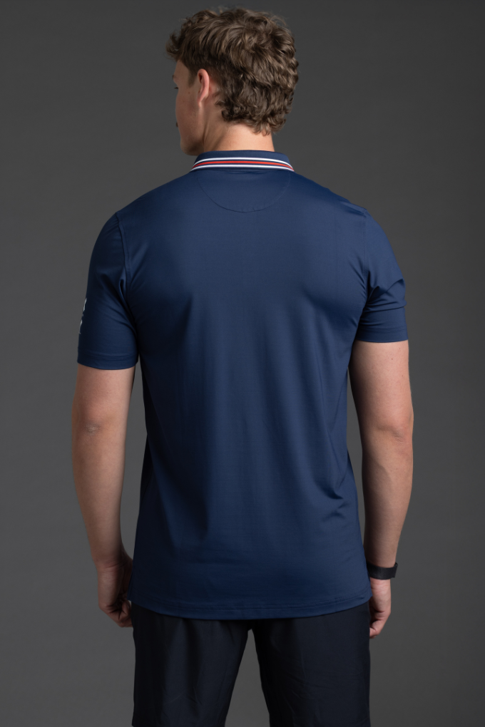 Person wearing a navy blue athletic shirt and shorts on a gray background || Navy