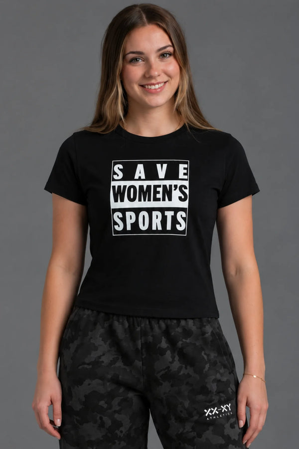 Female model smiling in a cropped black Save Women’s Sports tee with black camo sweatpants. || Black