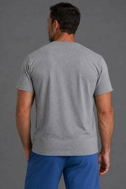 A man viewed from the back wearing a heather gray short-sleeve crewneck t-shirt and blue pants, set against a solid gray studio background. || Gray Camo