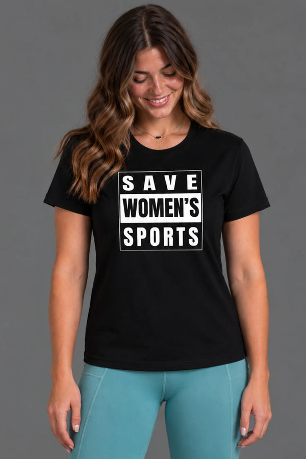 Female model smiling and looking down while wearing a black Save Women’s Sports tee with teal leggings. || Black