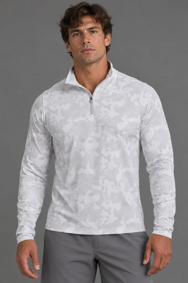 Male model facing forward in a white camo quarter-zip pullover with gray athletic shorts. || White Camo