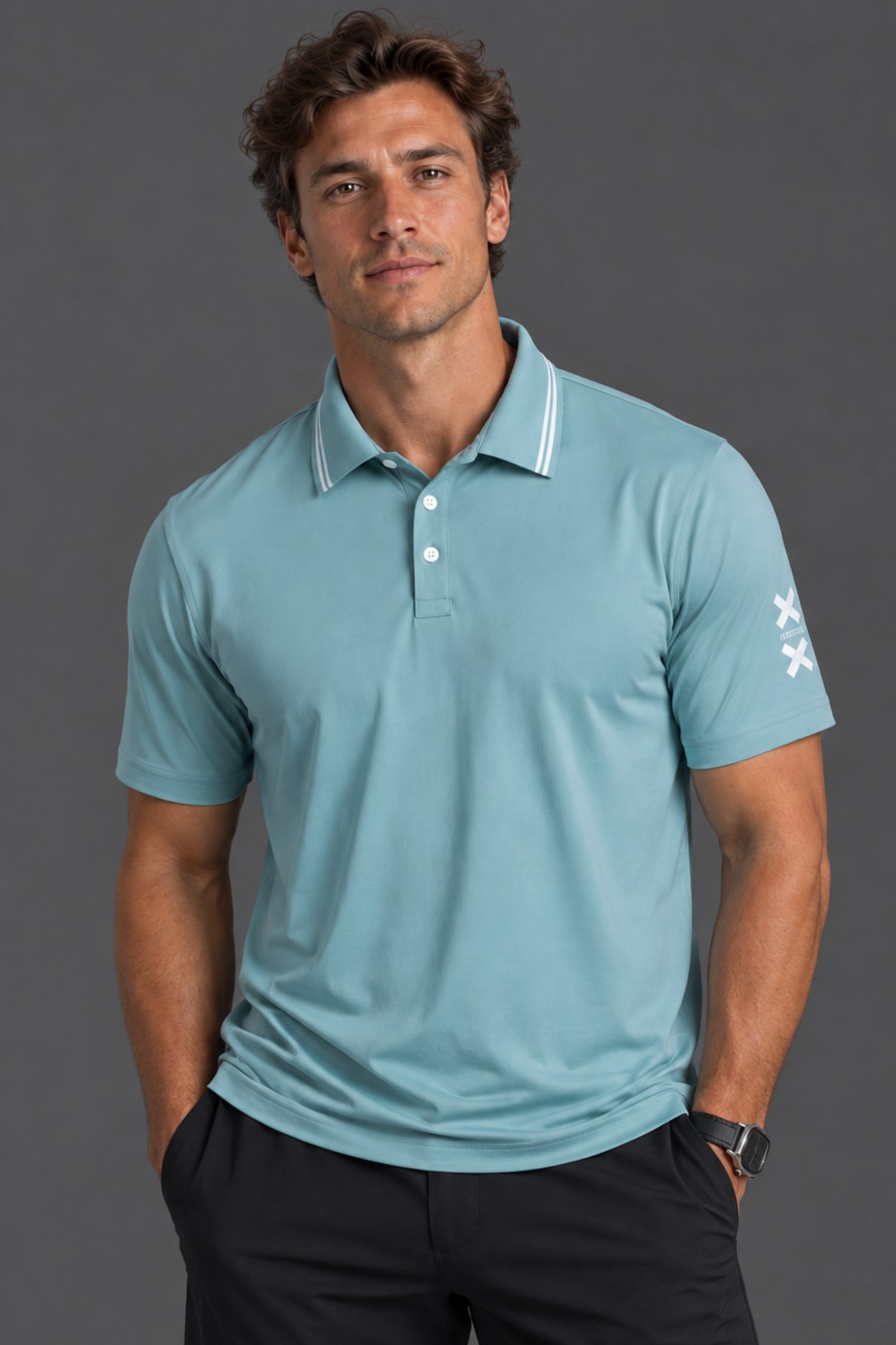 Male model wearing a light blue XX-XY Athletics performance polo with black shorts against a gray studio background.