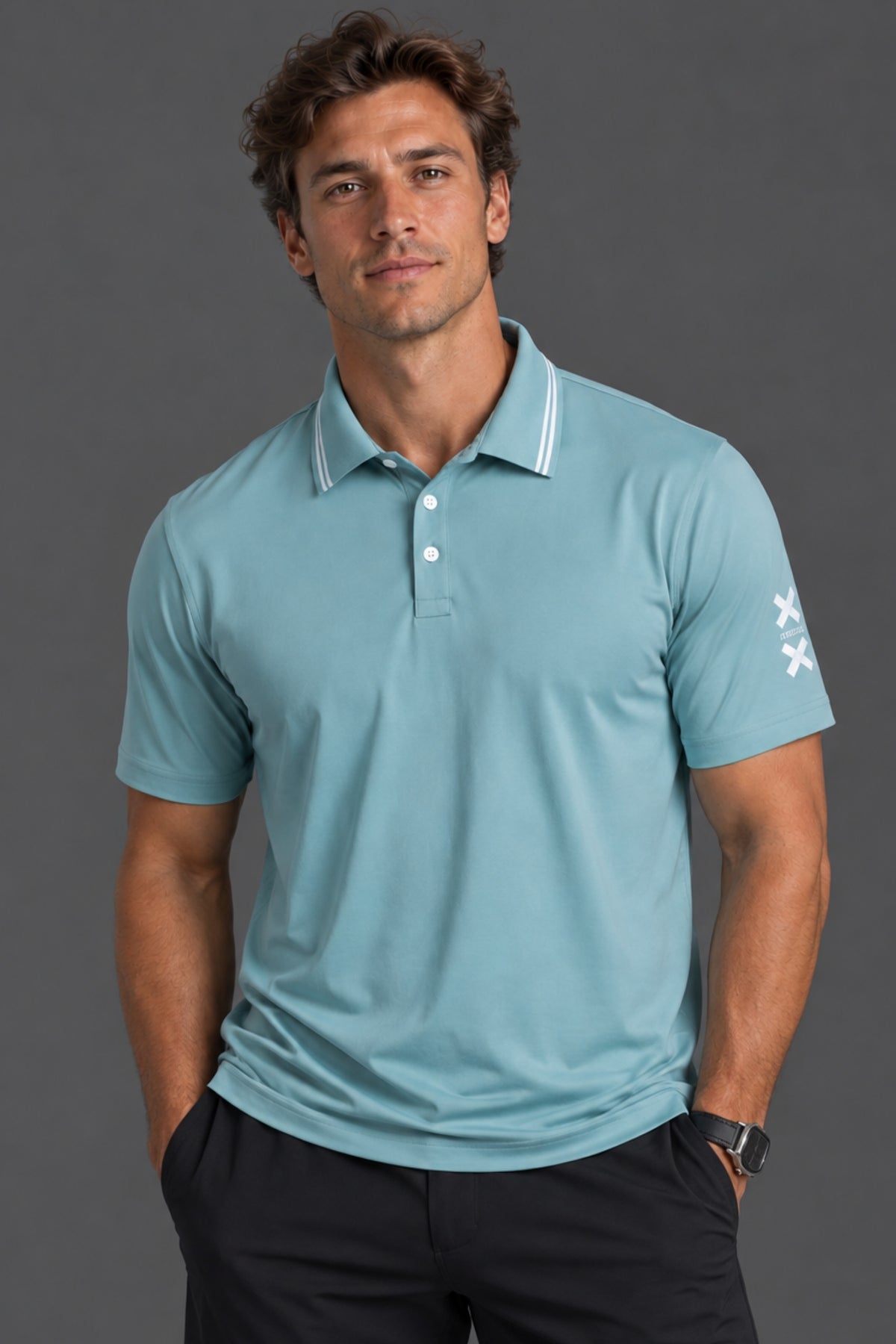 Male model wearing a light blue XX-XY Athletics performance polo with black shorts against a gray studio background. || Underseas