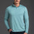 Man wearing a light blue long-sleeve shirt against a gray background || Underseas