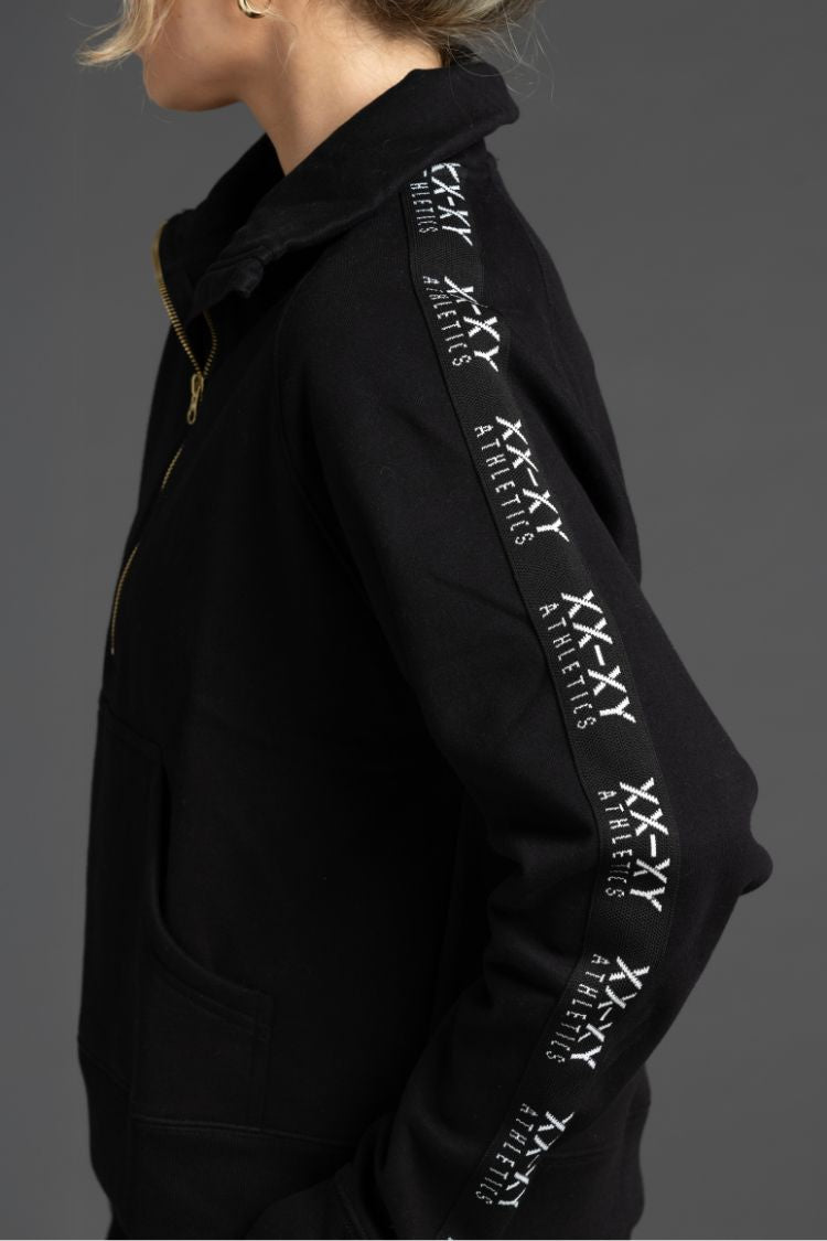 Black hoodie with white text on sleeves against a gray background || Black