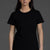 Person wearing a black t-shirt and gray pants against a dark background || Black