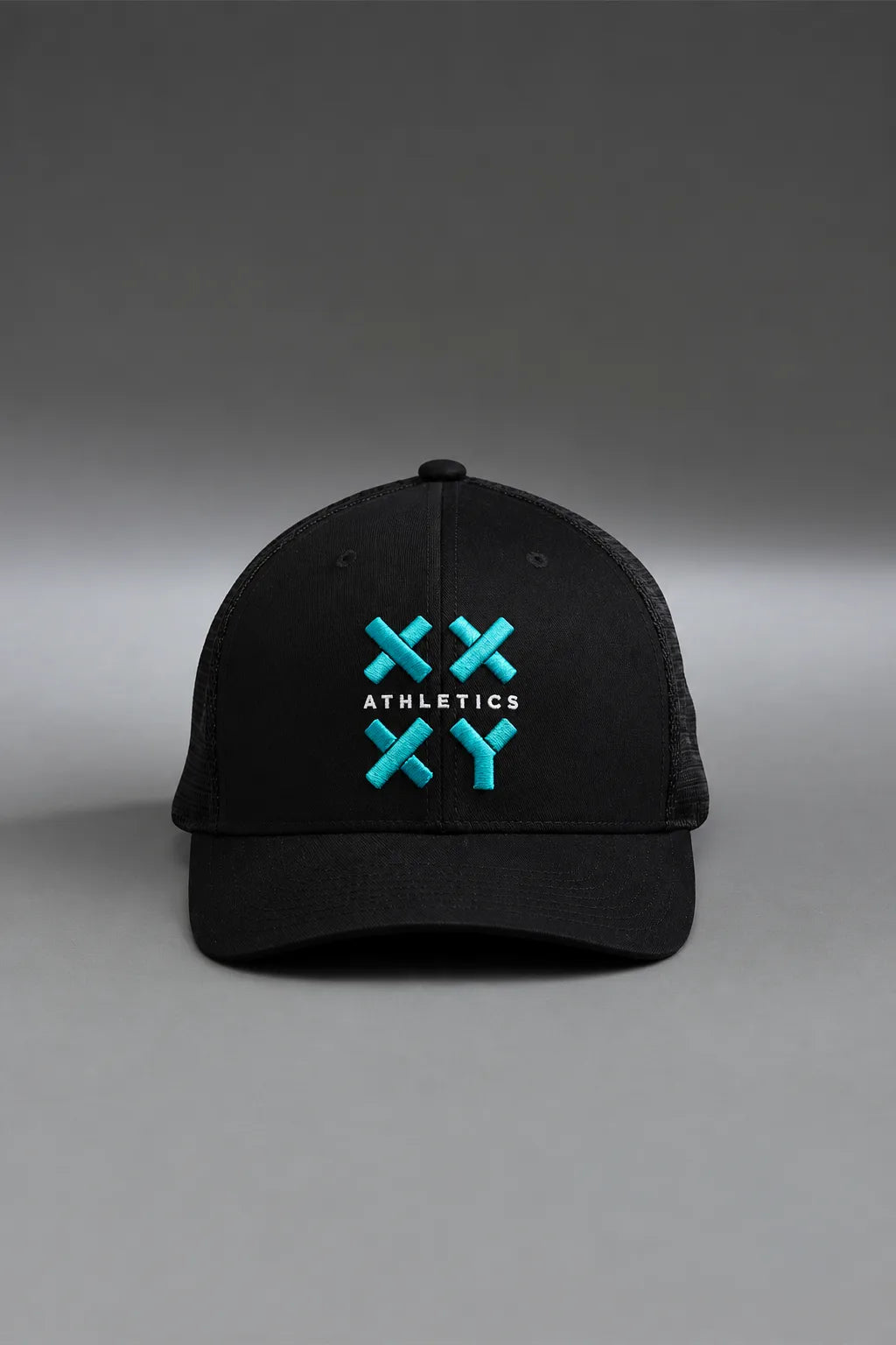 Black cap with green logo on a gray background