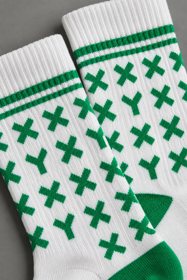Zoomed in shot of white XX-XY Athletics crew socks with green X and Y's. || kelly green