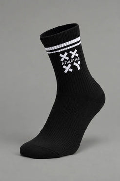 A single black crew sock with white stripes and a white crossed-knife logo featuring the word 'ATHLETICS' on the side, shown against a solid gray background. || Black