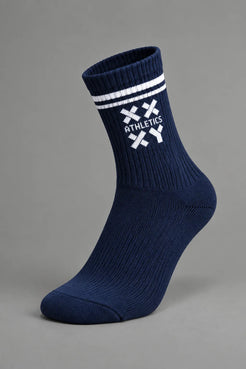 A single navy crew sock with white stripes and a white crossed-knife logo featuring the word 'ATHLETICS' on the side, shown against a solid gray background. || Navy