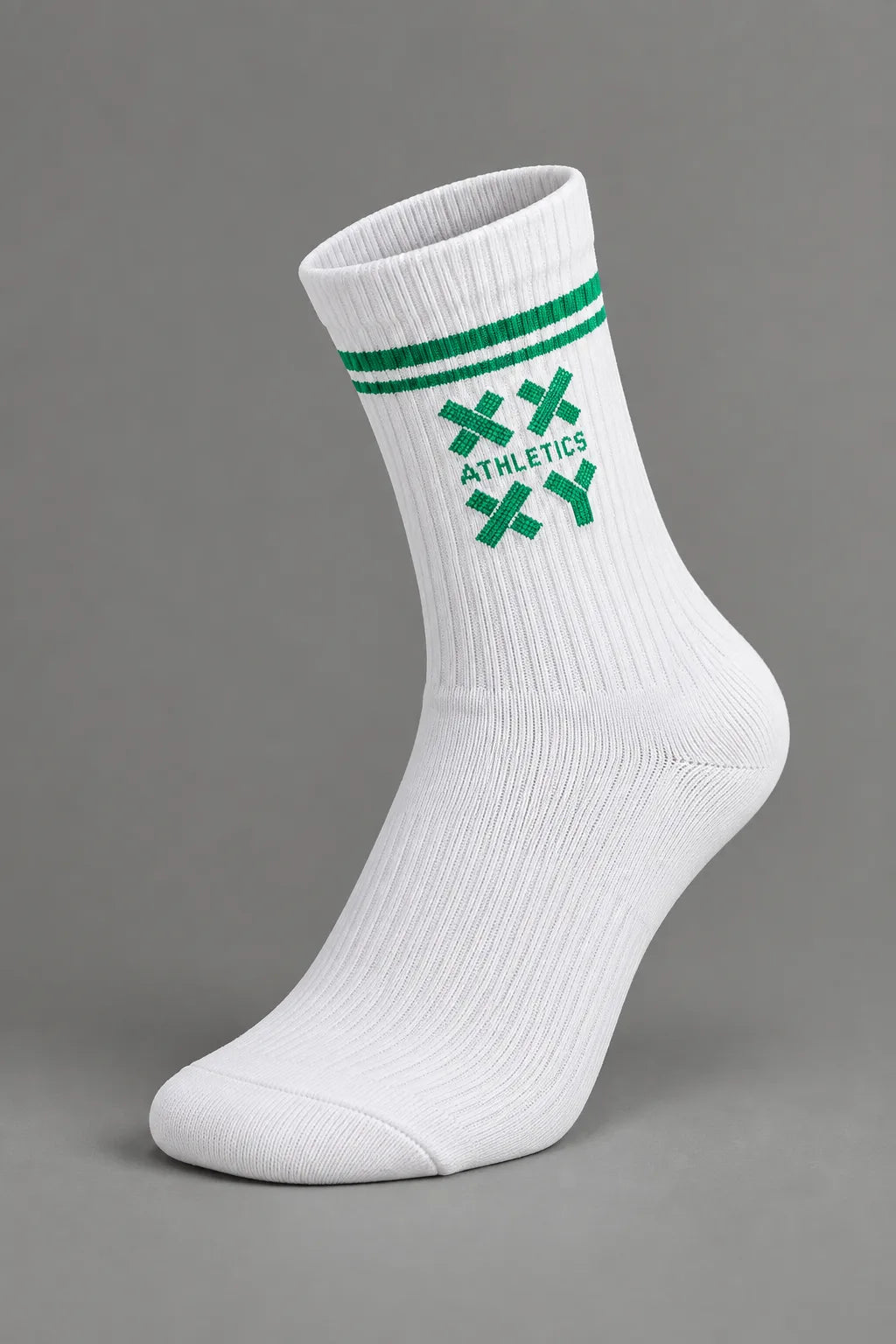 A single white crew sock with white stripes and a white crossed-knife logo featuring the word 'ATHLETICS' on the side, shown against a solid gray background. || White