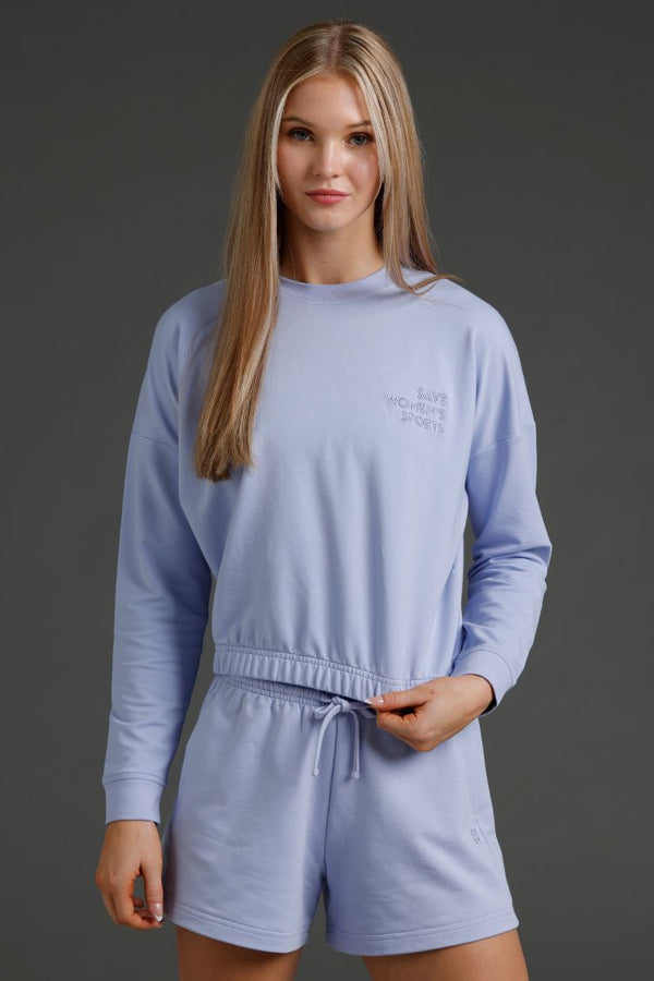 Woman wearing a Lavender Gray loungewear set with a dark gray background || Lavender Gray
