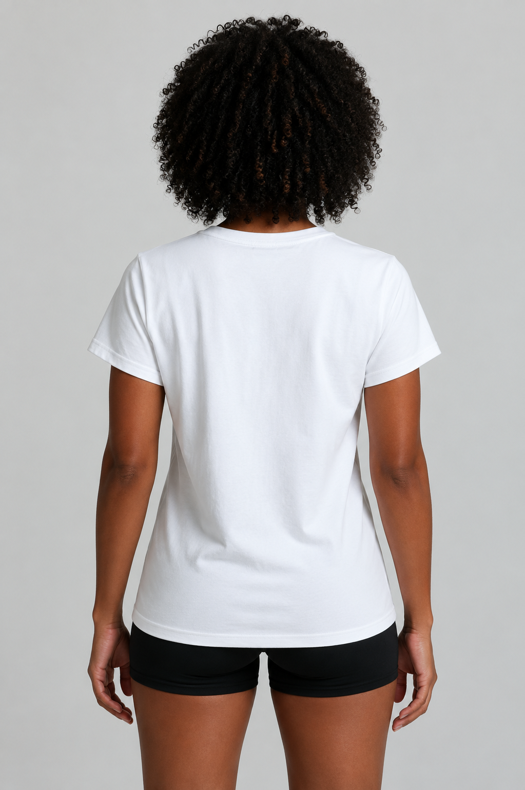 Woman wearing a white t-shirt facing backwards on a gray background || White
