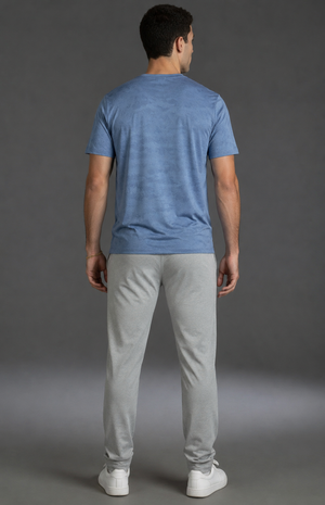 Man wearing a blue t-shirt and gray pants against a gray background || Light Heather Gray - 1