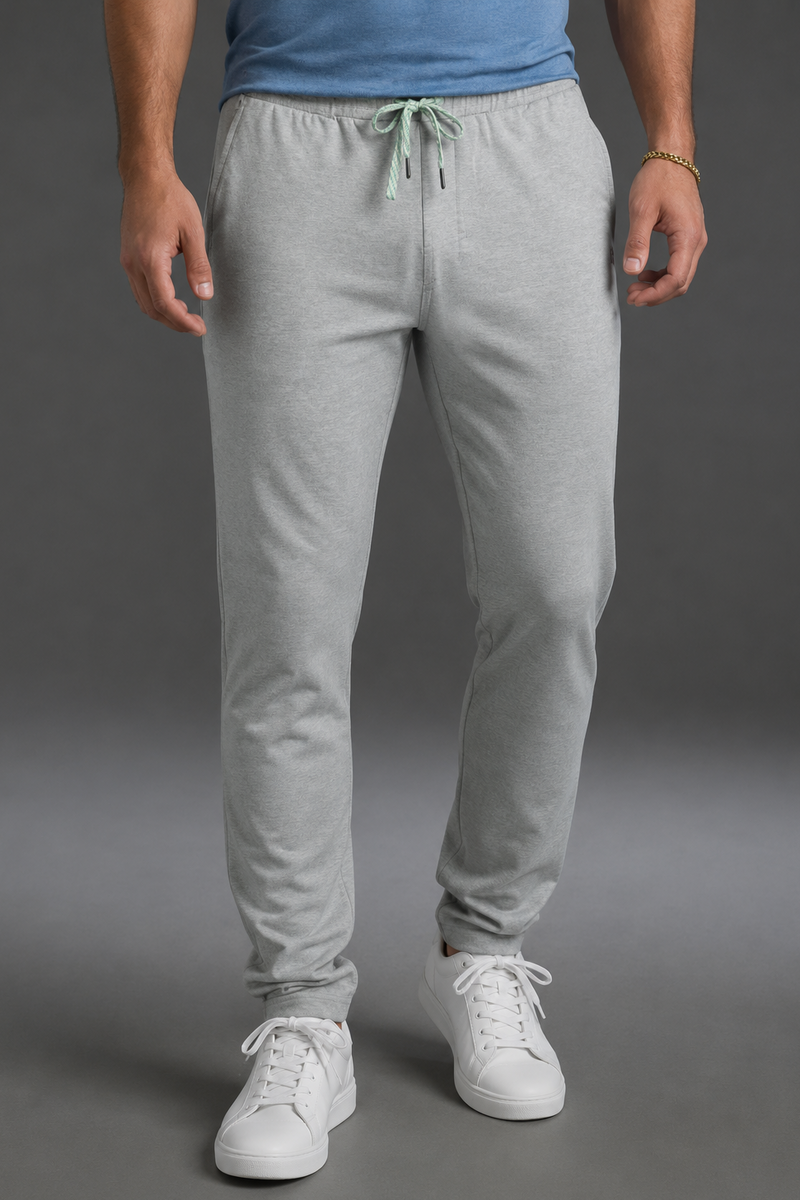 Person wearing gray sweatpants and white sneakers on a gray background || Light Heather Gray - 1