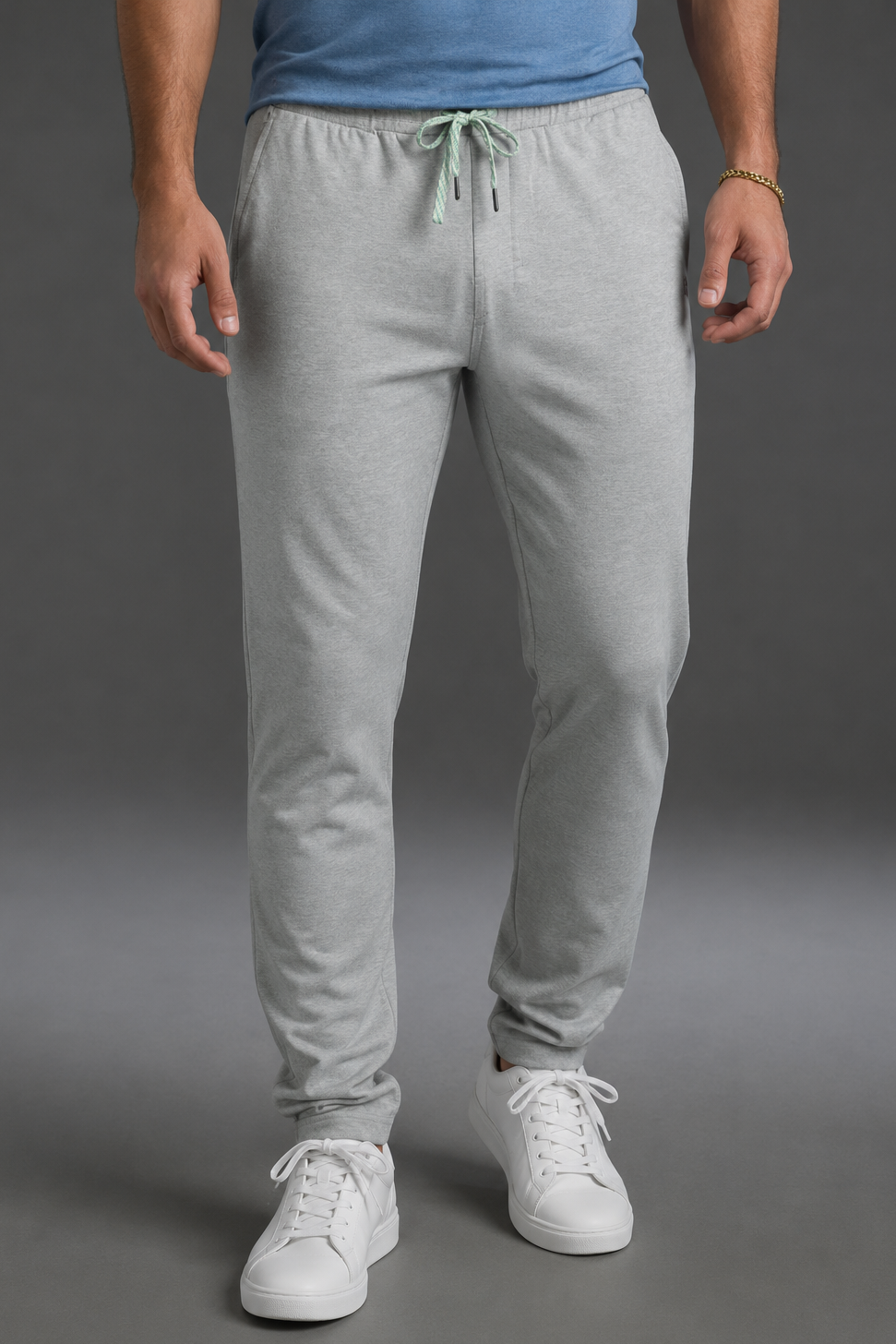 Person wearing gray sweatpants and white sneakers on a gray background || Light Heather Gray - 1