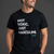 Man wearing a black t-shirt with white text on a gray background || Black