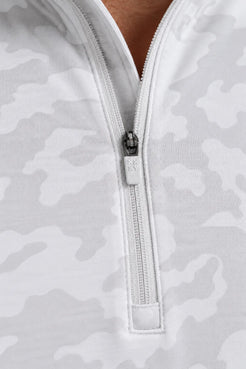 Close-up of the zipper and fabric detail on a white camo quarter-zip pullover. || White Camo