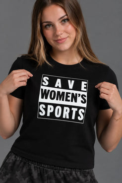 Close-up of a female model holding a black tee to highlight the white Save Women’s Sports graphic. || Black