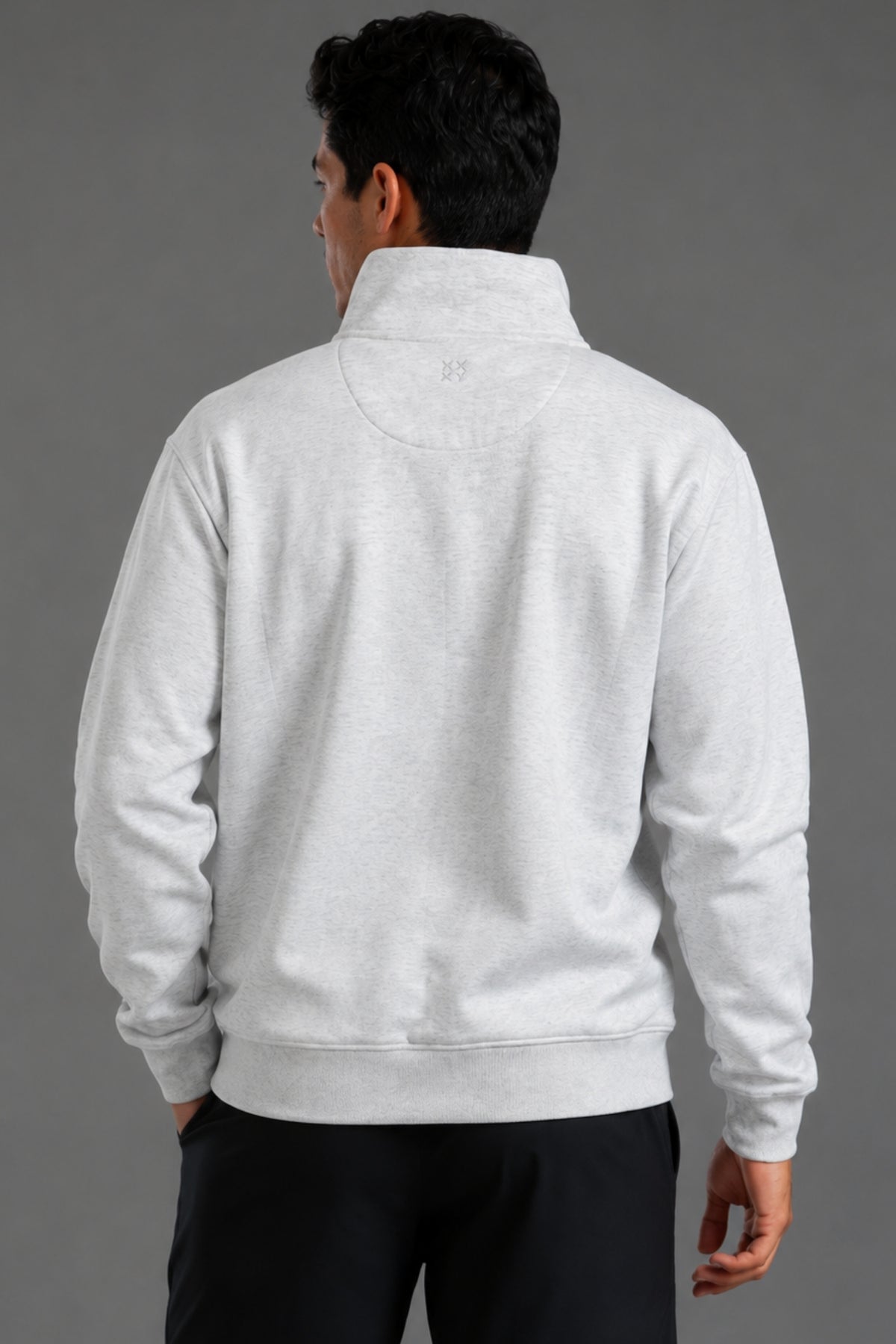 Male model wearing a light gray XX-XY Athletics quarter-zip fleece, shown in a back shot highlighting the back of the fleece.