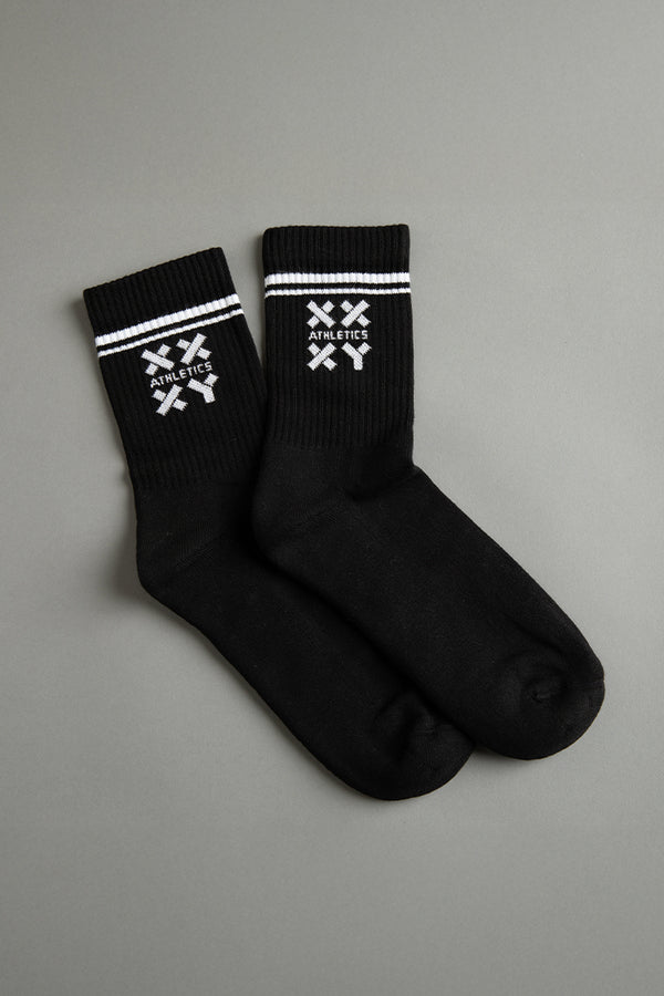 Black socks with white logo on a gray background || black