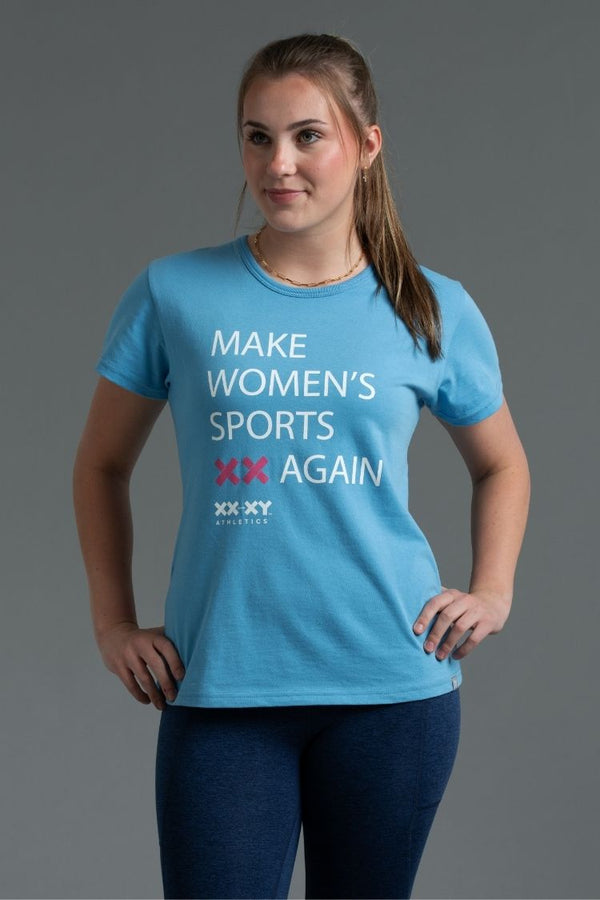 Woman wearing a blue t-shirt with text on a gray background || light blue