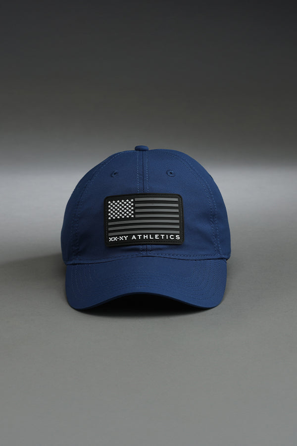 Blue cap with American flag patch and 'XX-KY Athletics' text on a gray background || blue