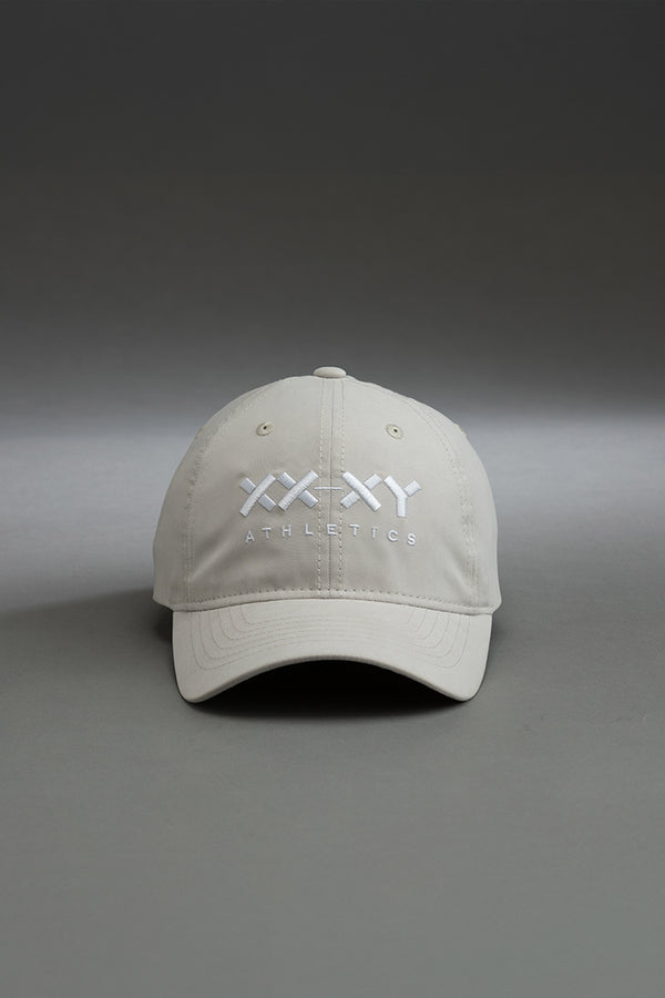 Beige cap with 'XX-XY Athletics' logo on a gray background