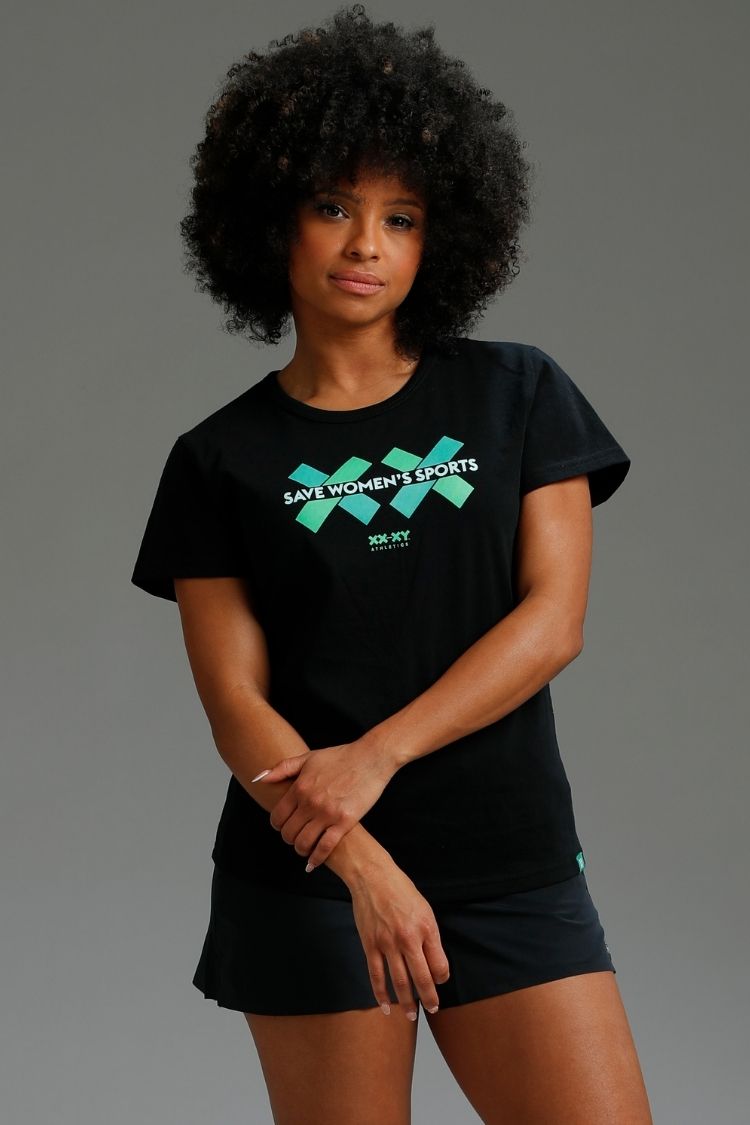 Person wearing a black t-shirt with green text on a gray background || black
