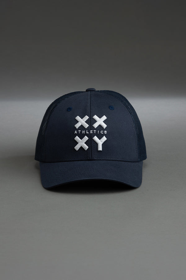 Navy blue cap with white logo on a gray background || navy with white logo