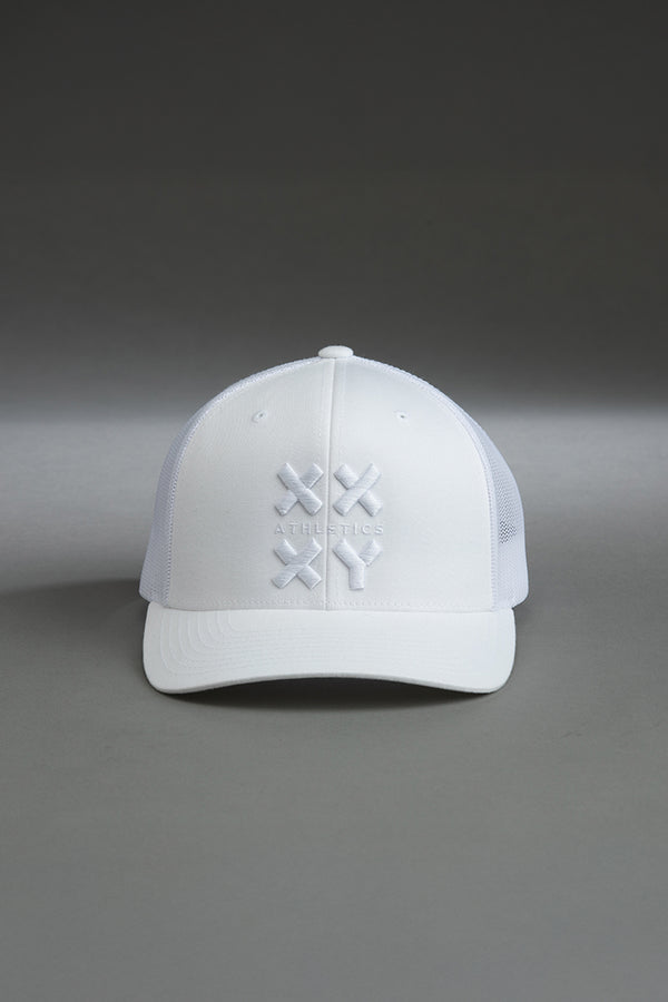 White cap with a logo on a gray background || white with white logo