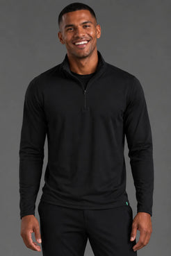 Male model smiling in the Men’s Black Quarter Zip with matching black joggers. || Black