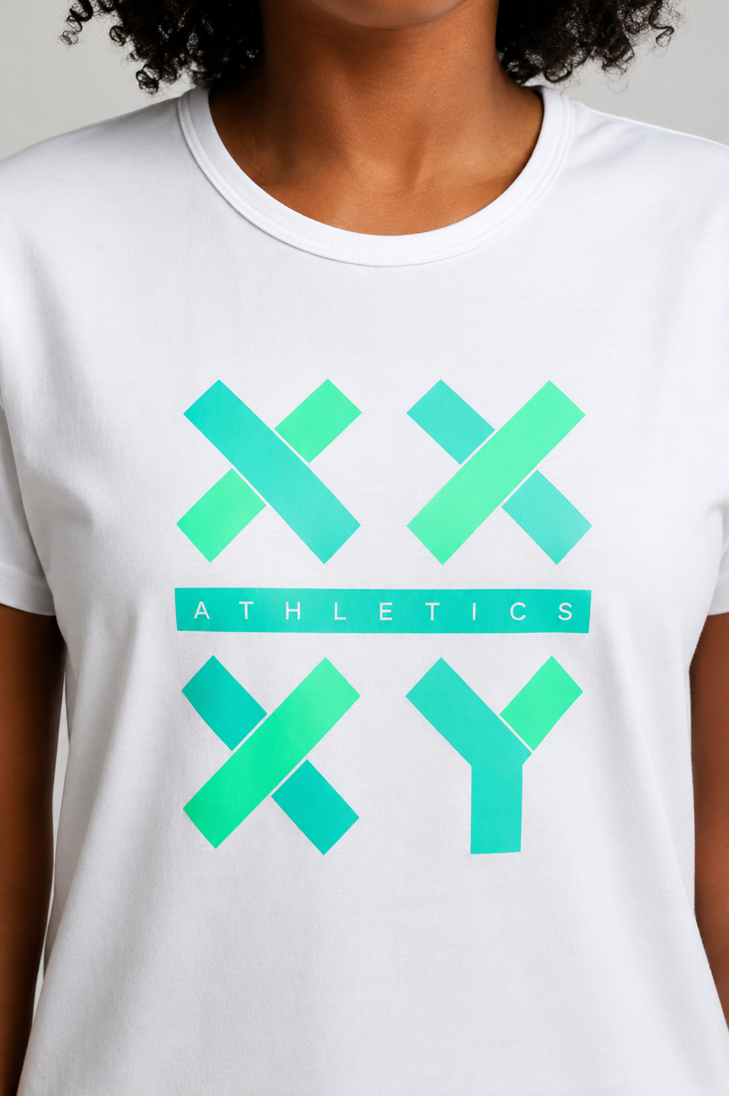 Person wearing a white t-shirt with green graphics on a plain background || white
