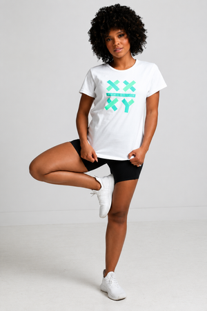 Person wearing a white t-shirt with green graphics on a plain background || white