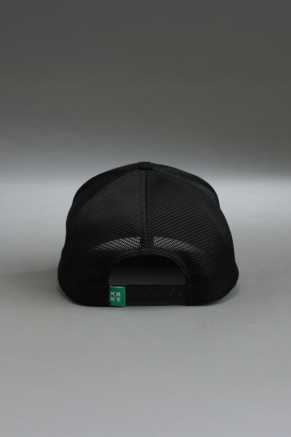 Black cap with a green label on a gray background || black with color logo